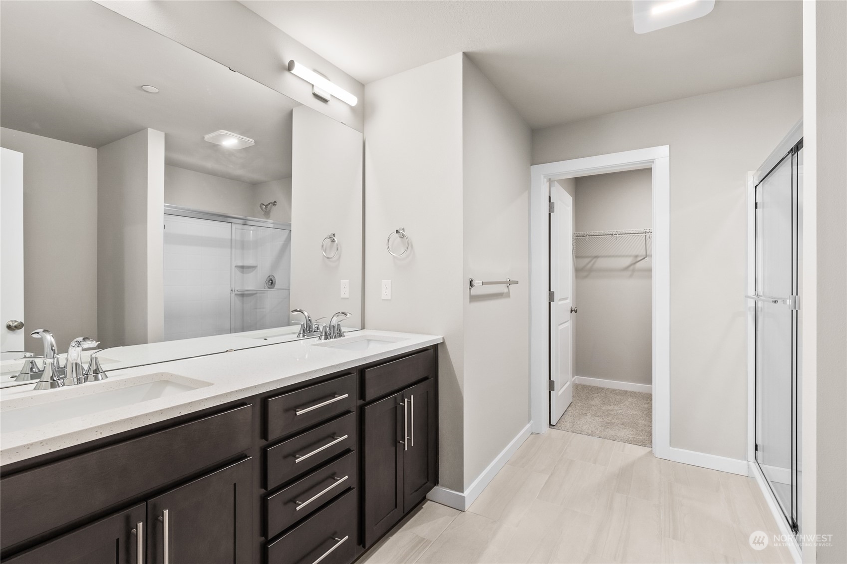 23413 Edmonds Way, Unit E1 Edmonds, WA 98026 - Photo 18 of 27 a bathroom with a sink double vanity and a mirror