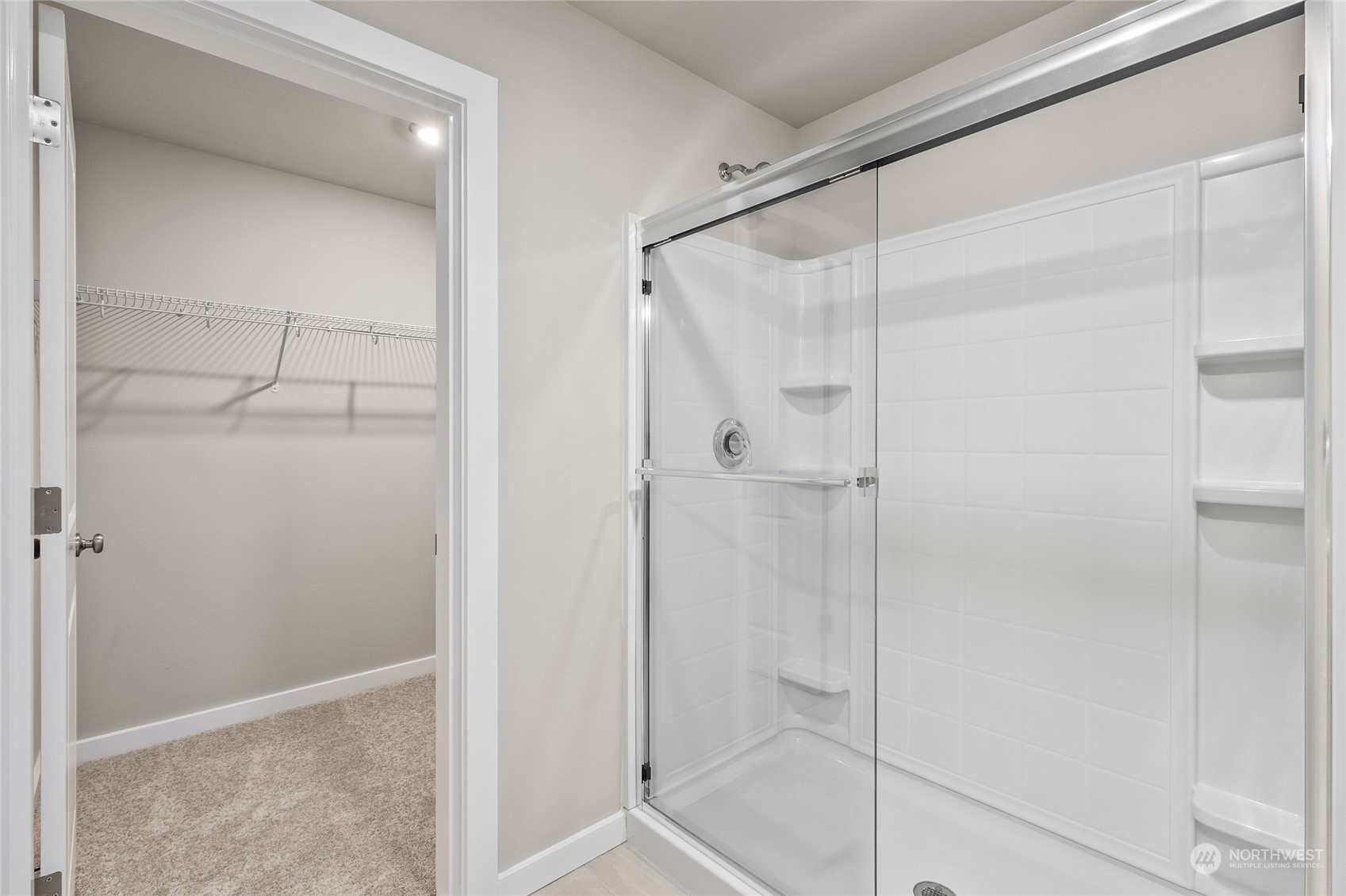 23413 Edmonds Way, Unit E1 Edmonds, WA 98026 - Photo 19 of 27 a bathroom with a glass shower door