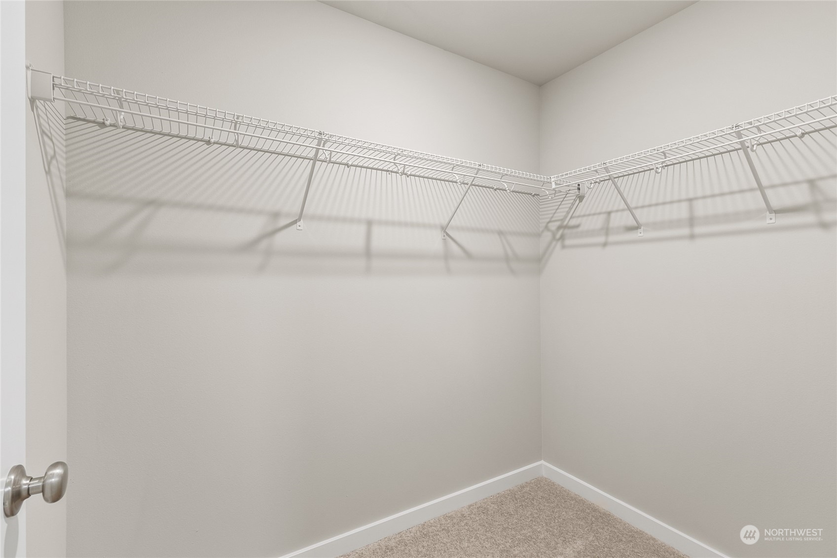 23413 Edmonds Way, Unit E1 Edmonds, WA 98026 - Photo 20 of 27 a view of a room with racks on the wall