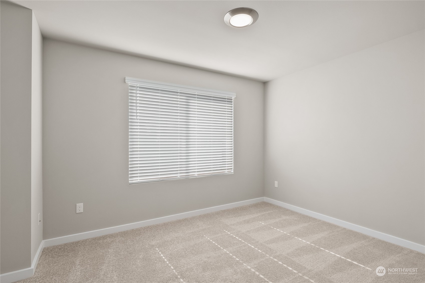 23413 Edmonds Way, Unit E1 Edmonds, WA 98026 - Photo 21 of 27 a view of an empty room with a window