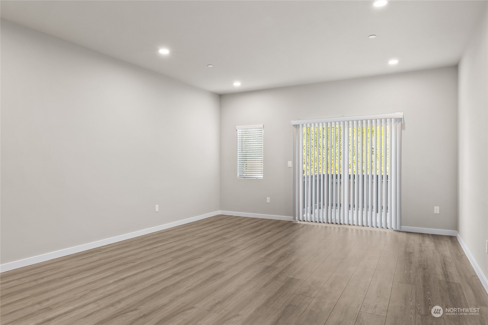 23413 Edmonds Way, Unit E1 Edmonds, WA 98026 - Photo 4 of 27 wooden floor in an empty room with a window