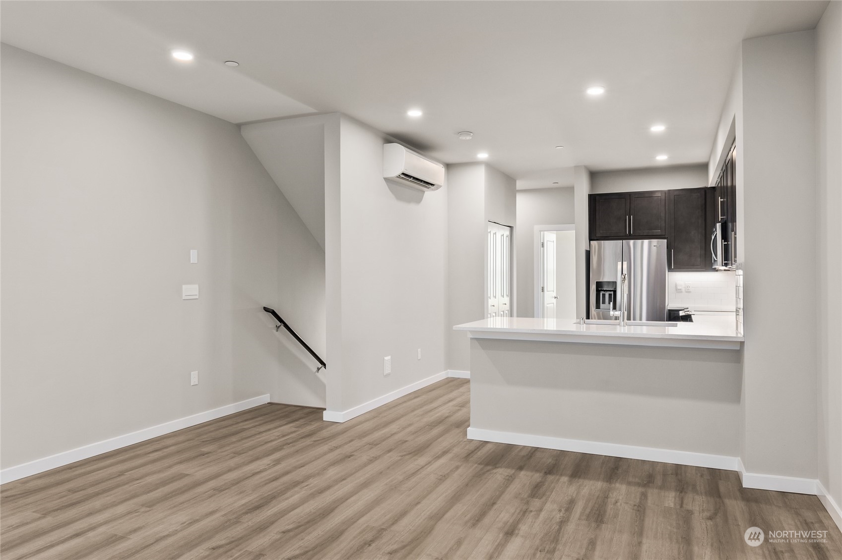 23413 Edmonds Way, Unit E1 Edmonds, WA 98026 - Photo 6 of 27 a view of kitchen with wooden floor and window