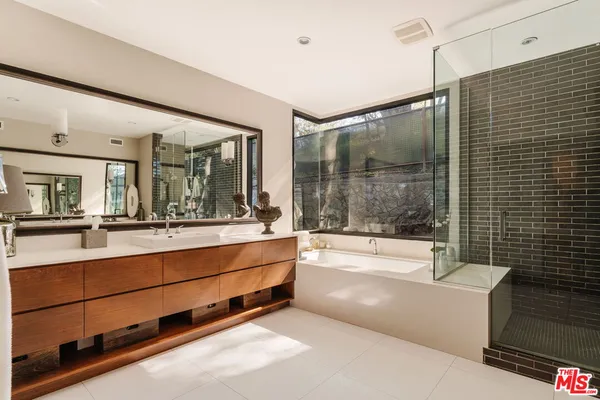 a bathroom with bathtub and shower