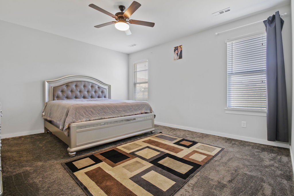 917 Plowson Road Mount Juliet, TN 37122 - Photo 16 of 47 a bedroom with a bed and a window