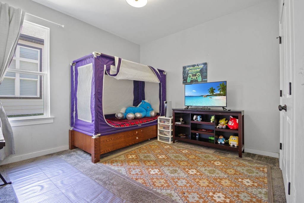 917 Plowson Road Mount Juliet, TN 37122 - Photo 23 of 47 a bedroom with furniture and a flat screen tv
