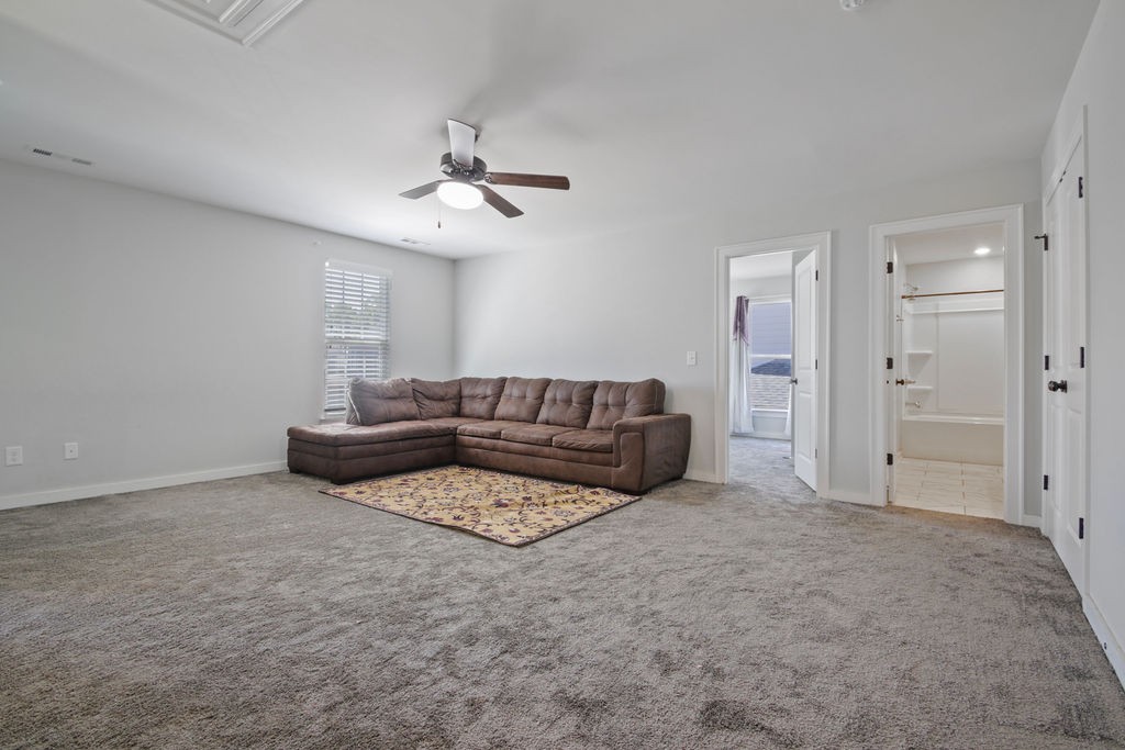 917 Plowson Road Mount Juliet, TN 37122 - Photo 27 of 47 a living room with furniture and a ceiling fan