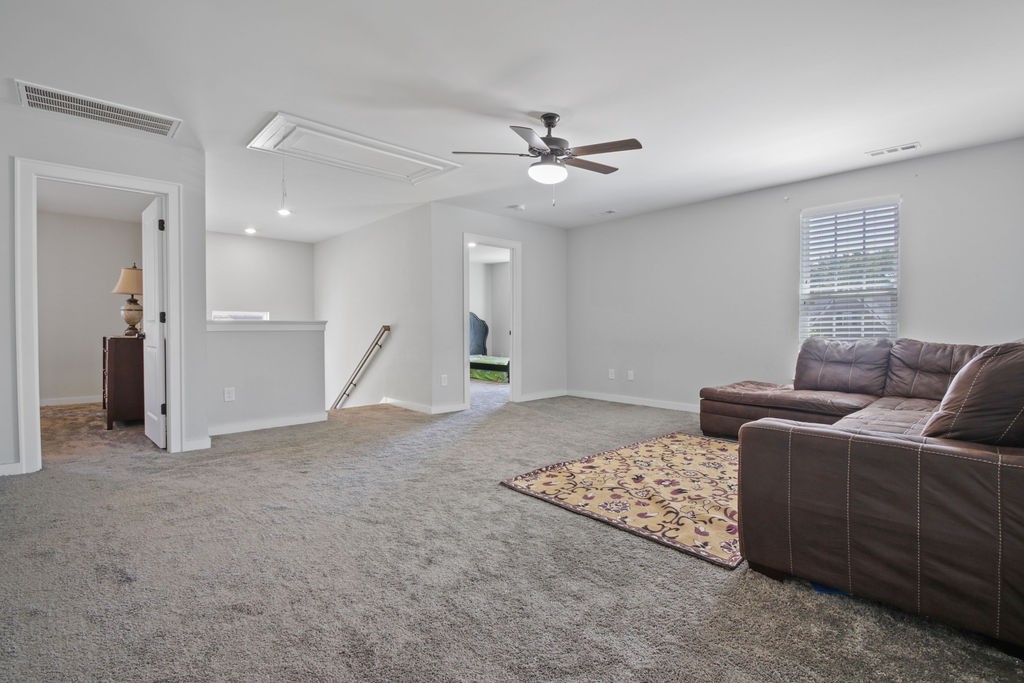 917 Plowson Road Mount Juliet, TN 37122 - Photo 28 of 47 a living room with furniture and a ceiling fan