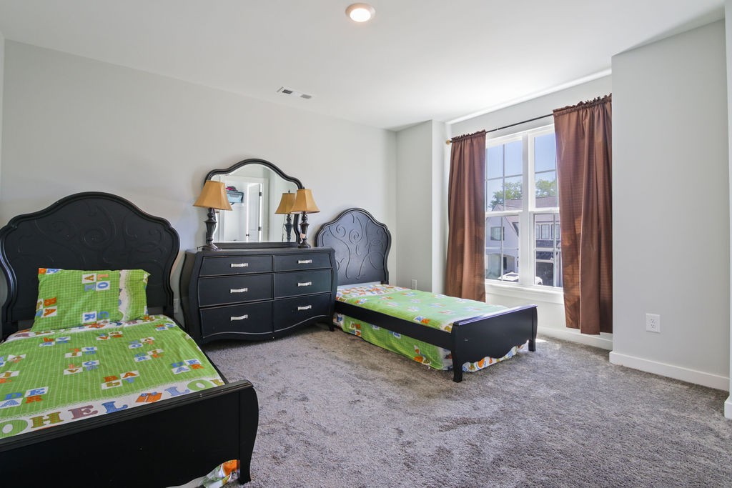 917 Plowson Road Mount Juliet, TN 37122 - Photo 32 of 47 a room with a bed and a window