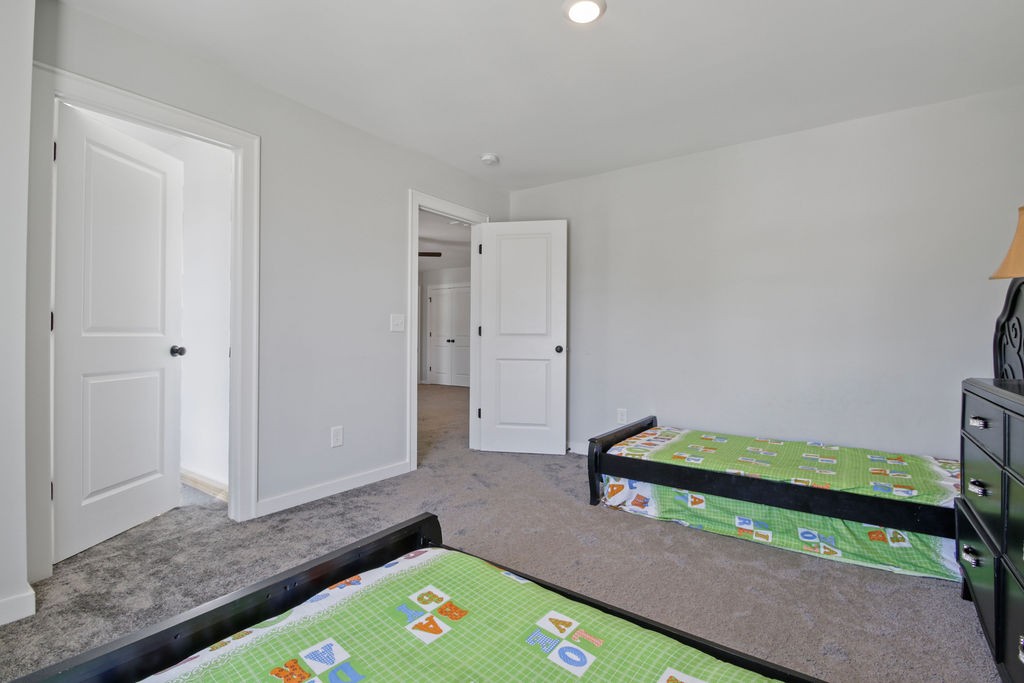 917 Plowson Road Mount Juliet, TN 37122 - Photo 33 of 47 a room with a bed and a rug