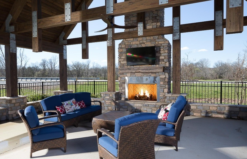 917 Plowson Road Mount Juliet, TN 37122 - Photo 40 of 47 a living room with furniture fireplace and a floor to ceiling window