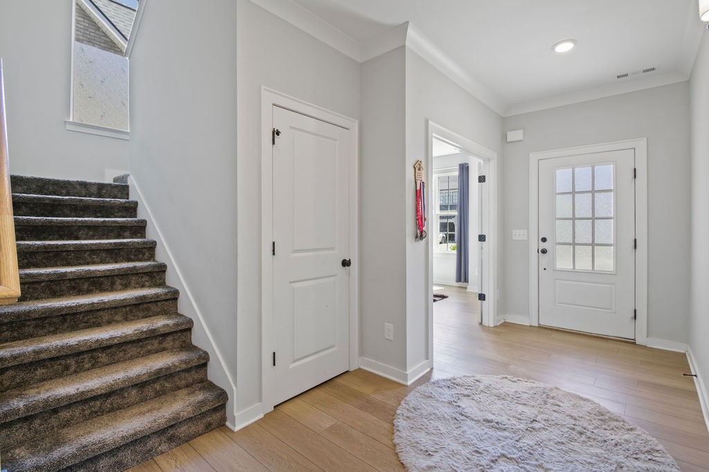917 Plowson Road Mount Juliet, TN 37122 - Photo 6 of 47 a view of a hallway with wooden floor and entryway