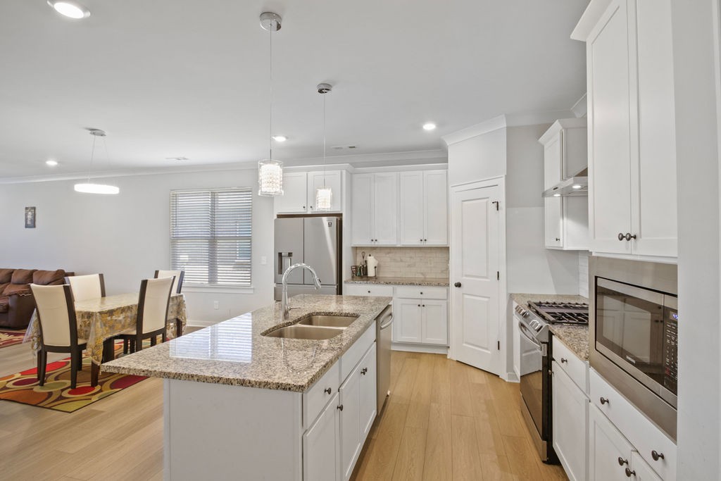 917 Plowson Road Mount Juliet, TN 37122 - Photo 9 of 47 a kitchen with a sink stainless steel appliances and cabinets
