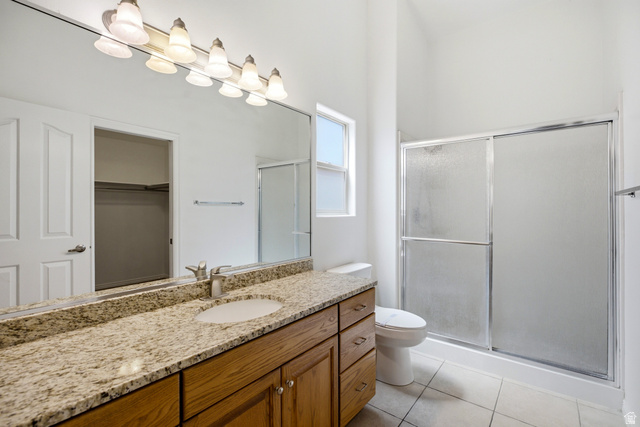 1630 East 2450th Street South, Unit 263 St. George, UT 84790 - Photo 15 of 24 Bathroom featuring a wood-finish vanity with granite countertop, integrated sink, and chrome faucet