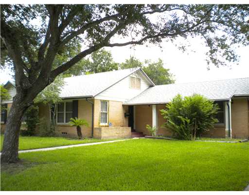 a front view of house with yard and outdoor seating