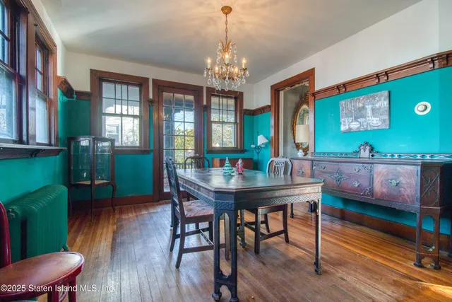 a kitchen with a checkered floor and a refrigerator