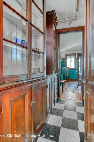a kitchen with a refrigerator and a sink