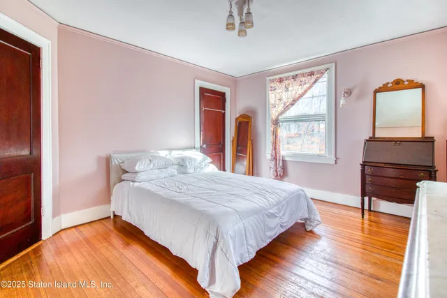 a view of a livingroom with hardwood and furniture