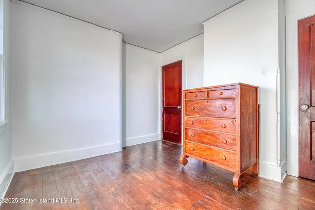 a view of a room with a table and chairs