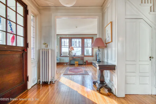 a view of a livingroom with furniture and a lamp