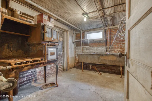 a view of a backyard with table and chairs and a fire pit