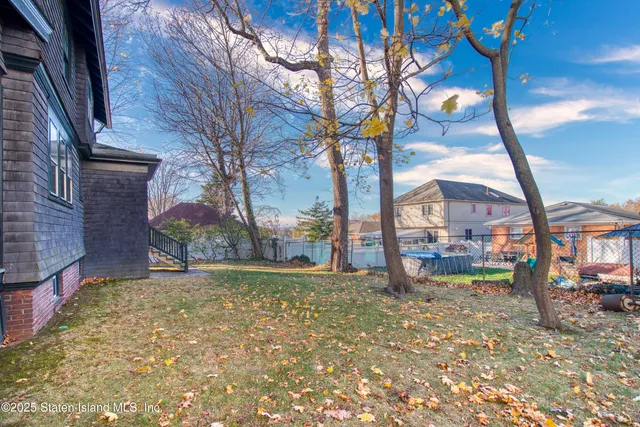 a view of a pathway with a yard