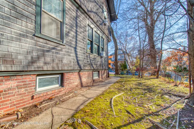 a view of a house with snow on the wall