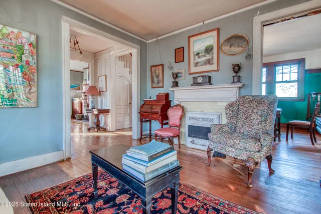 a living room with furniture and a gate