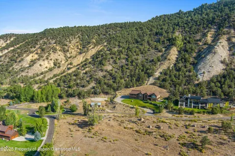 a view of a town with mountains in the background