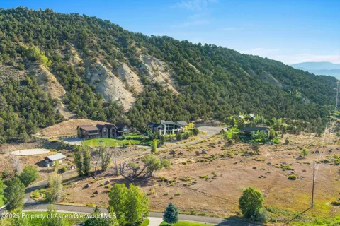 a view of a town with mountains in the background