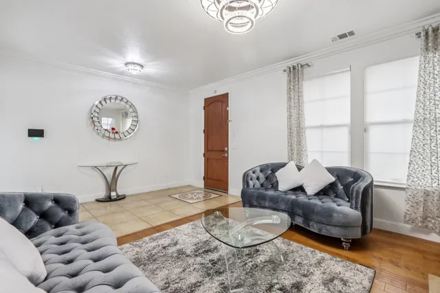 a bathroom with a granite countertop toilet sink and mirror