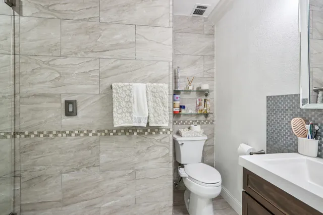 a bedroom with a bed and a lamp