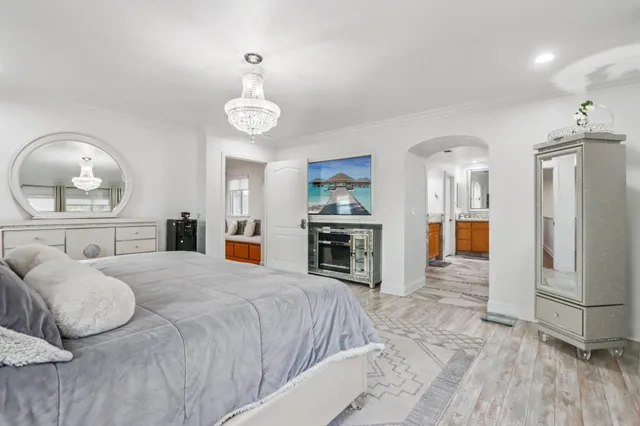 a view of a backyard with plants and patio