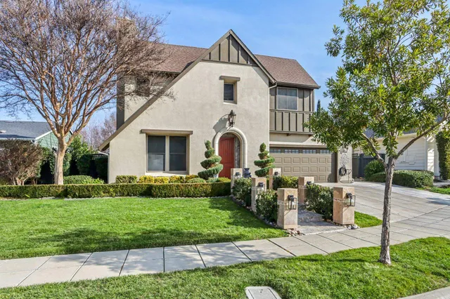 a front view of a house with garden