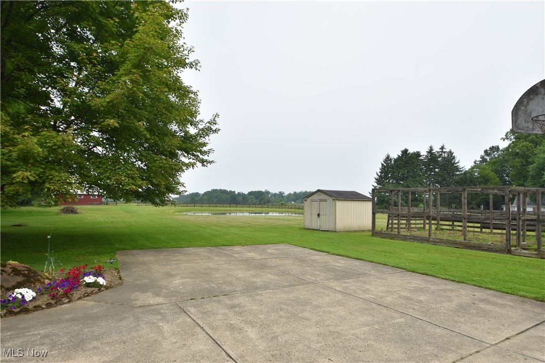11676 Lisbon Road Salem, OH 44460 - Photo 28 of 38 View of patio / terrace with a water view and a storage unit