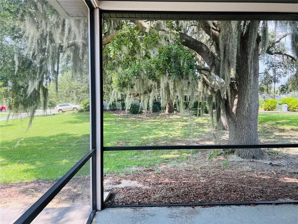 a view of a back yard from a balcony