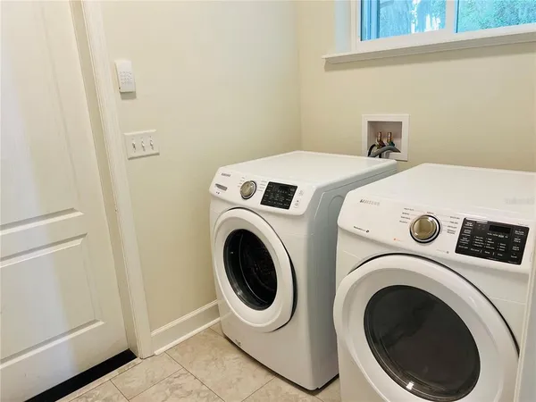 a utility room with dryer and washer