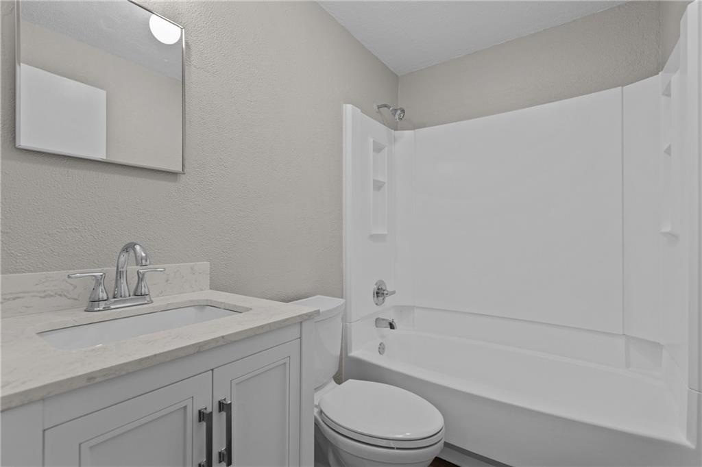 7440 Noblestown Road McDonald, PA 15057 - Photo 26 of 38 a bathroom with a sink a toilet and shower
