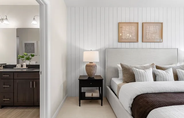 a bedroom with a bed and furniture