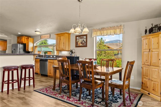 a view of a dining room with furniture window and wooden floor