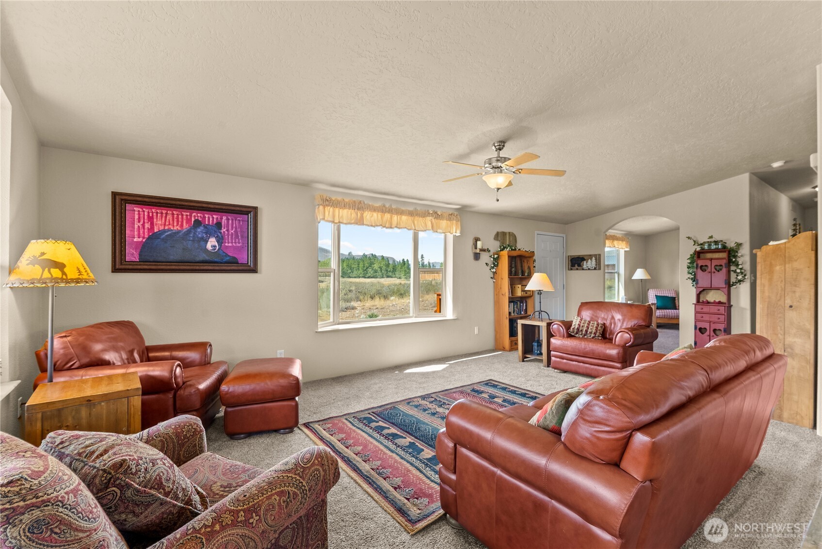 88 Horizon View Winthrop, WA 98862 - Photo 25 of 40 a living room with furniture ceiling fan and a window