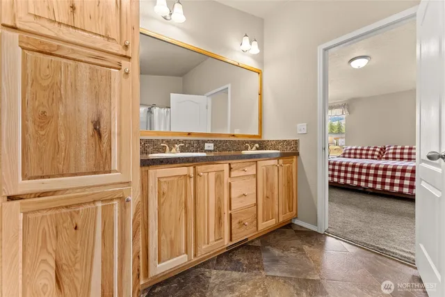 a view of a bedroom with furniture and window