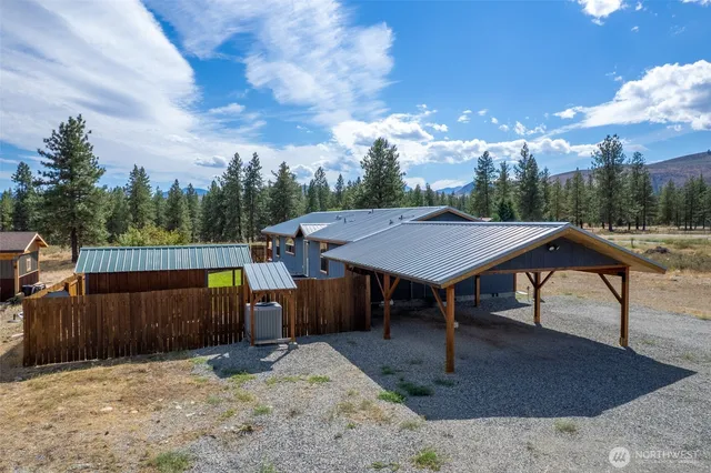 an aerial view of a house with a yard