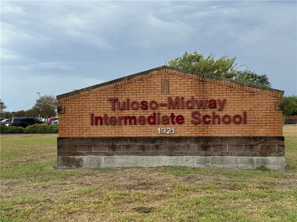 a view of a swimming pool with a yard