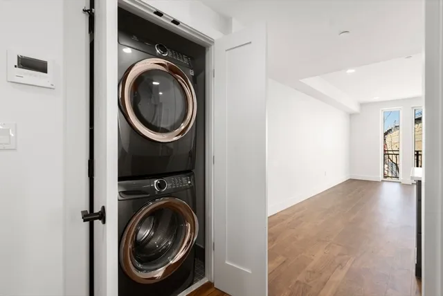 a view of a hallway with washer and dryer