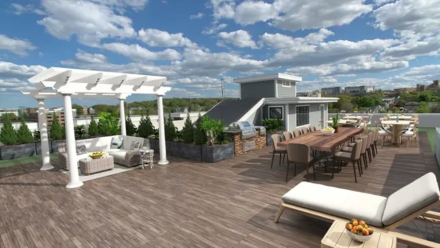 a view of yard from deck with patio