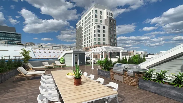 a view of a patio with couches table and chairs and potted plants