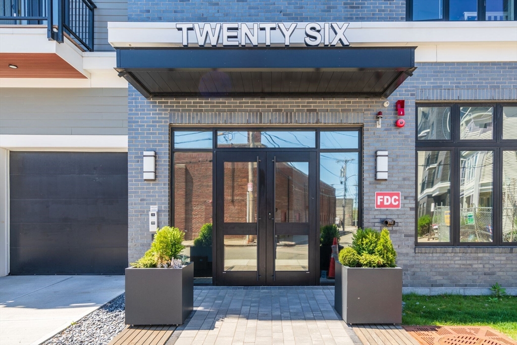 26 Hichborn Street, Unit 5 Boston, MA 02135 - Photo 17 of 17 a front view of a building with a garden