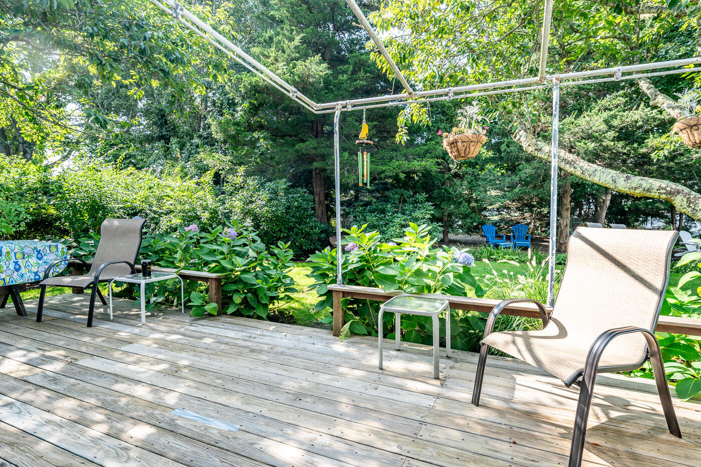 41 Joyce Anne Road Centerville, MA 02632 - Photo 31 of 33 a view of a chair and tables in the back yard of the house