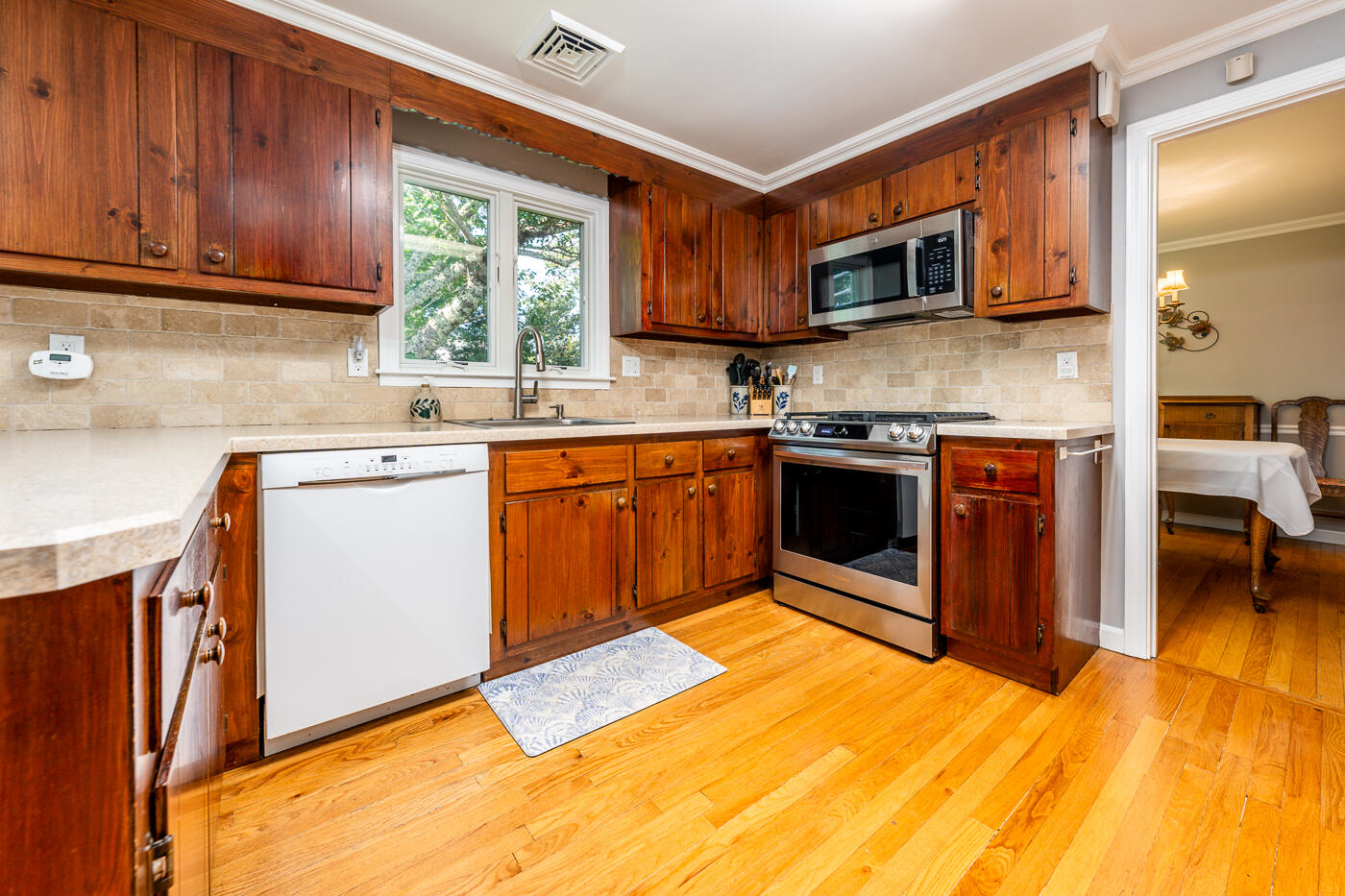 41 Joyce Anne Road Centerville, MA 02632 - Photo 5 of 33 a kitchen with stainless steel appliances granite countertop wooden cabinets a sink and a stove