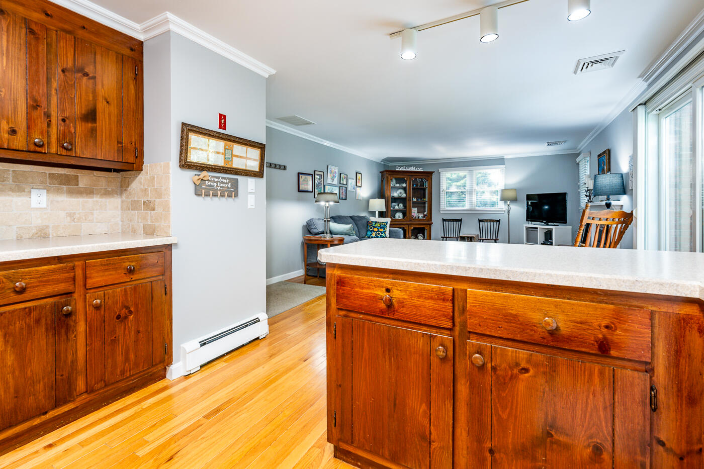 41 Joyce Anne Road Centerville, MA 02632 - Photo 7 of 33 a view of a kitchen with furniture and wooden floor